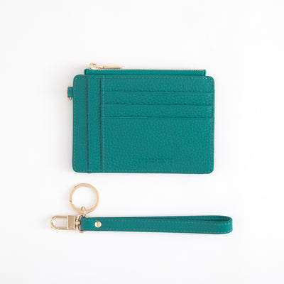 Teal wallet with keychain on a white background
